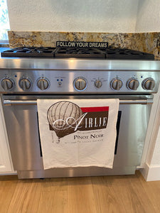 Airlie Pinot Noir Flour Sack Towel on stove